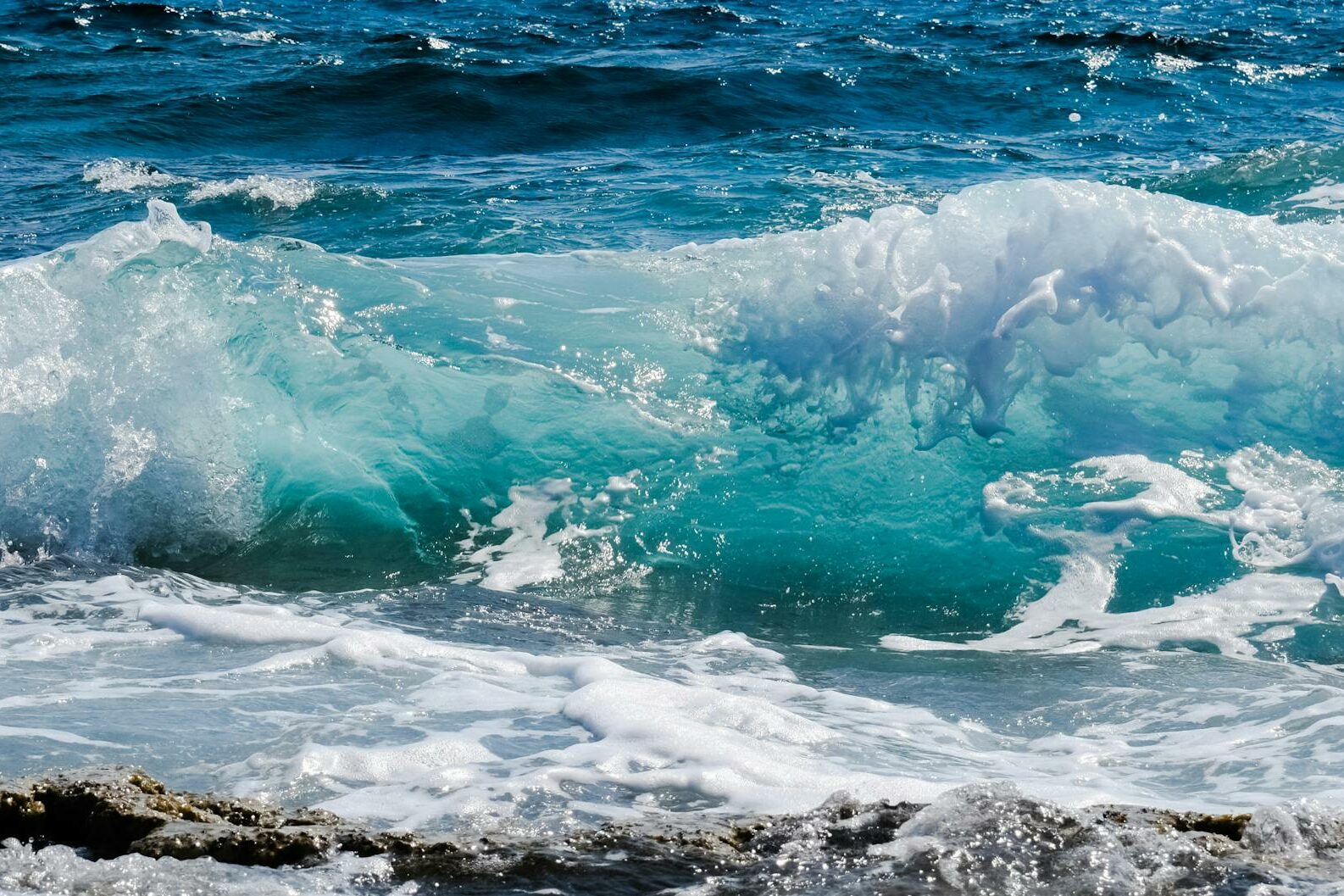 sea waves hitting rocks